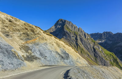 Scenic view of mountains against clear blue sky