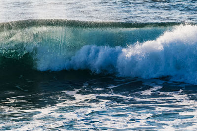 Close-up of waves splashing in sea