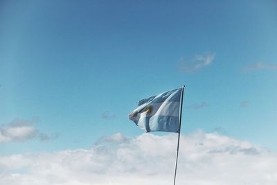 Low angle view of crane against blue sky