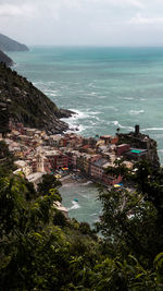 High angle view of buildings by sea