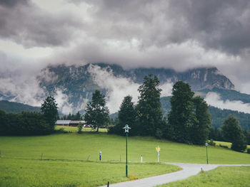 Scenic view of golf course against sky