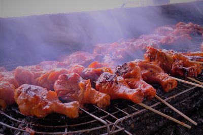 Close-up of meat on barbecue grill