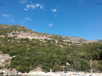 Scenic view of mountains against blue sky