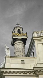 Low angle view of statue of building against sky