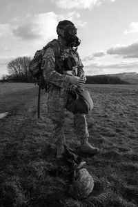 Full length of man standing on field against sky