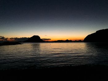 Scenic view of sea against clear sky during sunset