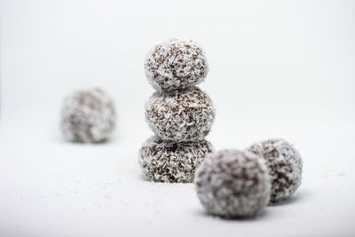 Close-up of figurines on white background