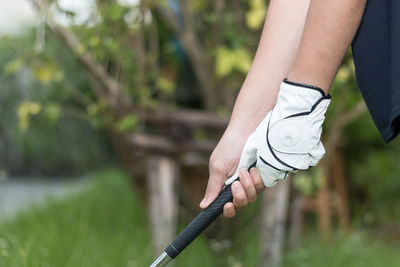 Low section of person holding plant