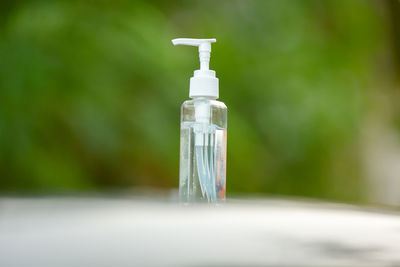 Close-up of bottle in glass