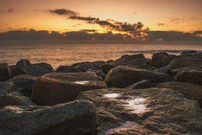 Scenic view of sea at sunset