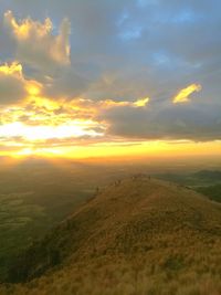 Scenic view of landscape against sky during sunset