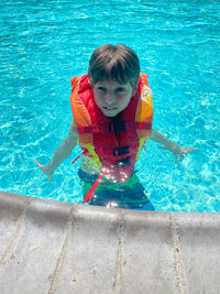 Portrait of boy in swimming pool