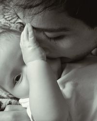 High angle view of man kissing child