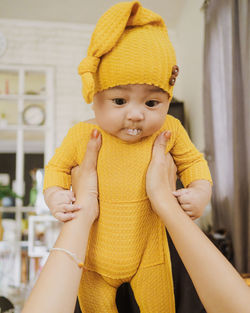 Portrait of cute baby girl at home