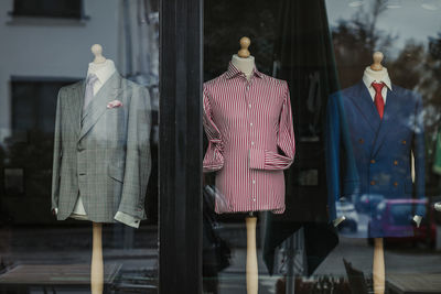 Clothes hanging on display at store