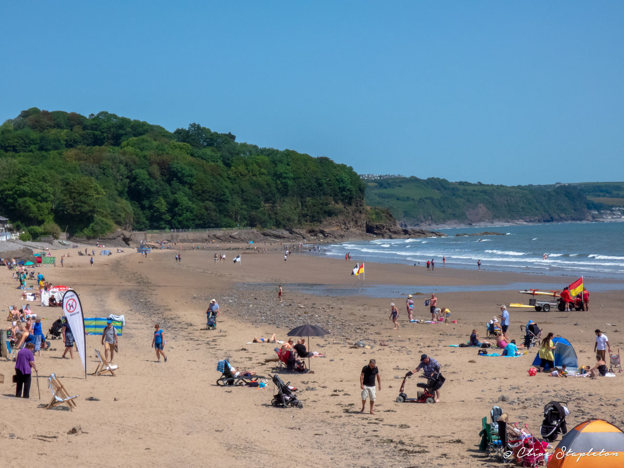 PEOPLE ON BEACH AGAINST SKY