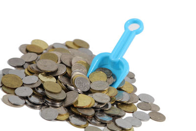 Close-up of coins on white background