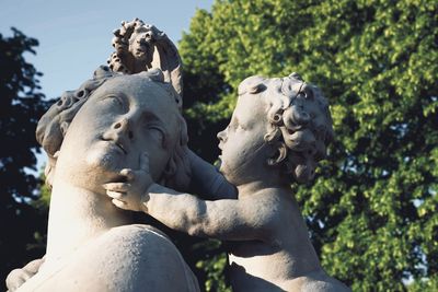 Low angle view of statue against sky