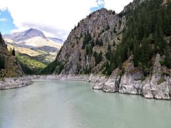 Panoramic view of river and mountains against sky