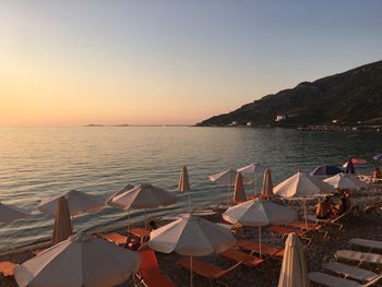 Scenic view of sea against clear sky during sunset