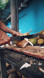 Midsection of person preparing food on wood