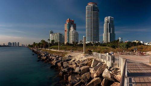 Modern buildings in city against sky