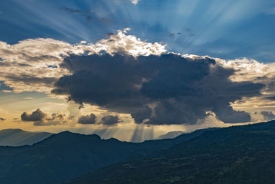 Scenic view of mountains against sky during sunset