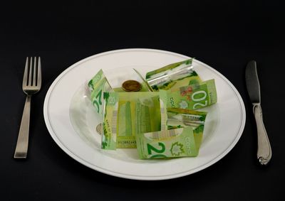 High angle view of food in plate against black background