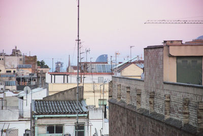 High angle view of buildings in city against clear sky