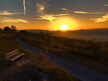 Scenic view of field against sky during sunset