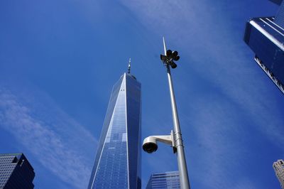 Low angle view of modern building against blue sky