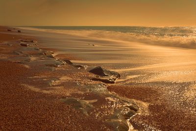 Scenic view of sea against sky at sunset