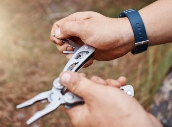 Cropped hand of man holding key