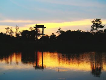 Scenic view of lake at sunset