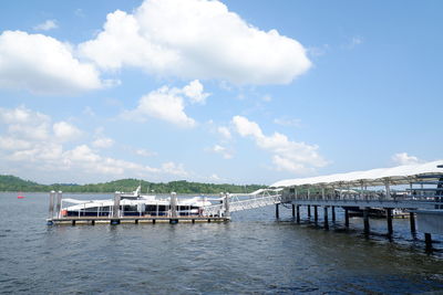 Pier over river against sky