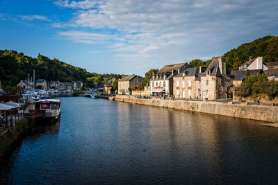 Panoramic view of river by buildings against sky