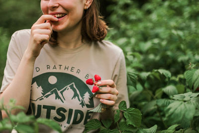 Hand picked freshly raspberries in garden