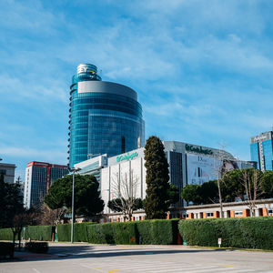 Modern buildings against sky in city