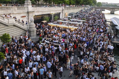 High angle view of crowded street by river