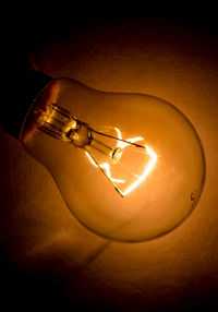 Close-up of illuminated light bulb