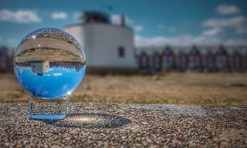 Close-up of crystal ball on field