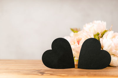 Valentines day  background with empty 2 black chalkboard heart on wooden. mockup with copy space .