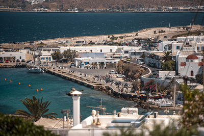 High angle view of townscape by sea