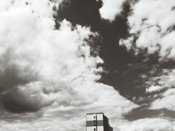 Low angle view of built structure against cloudy sky