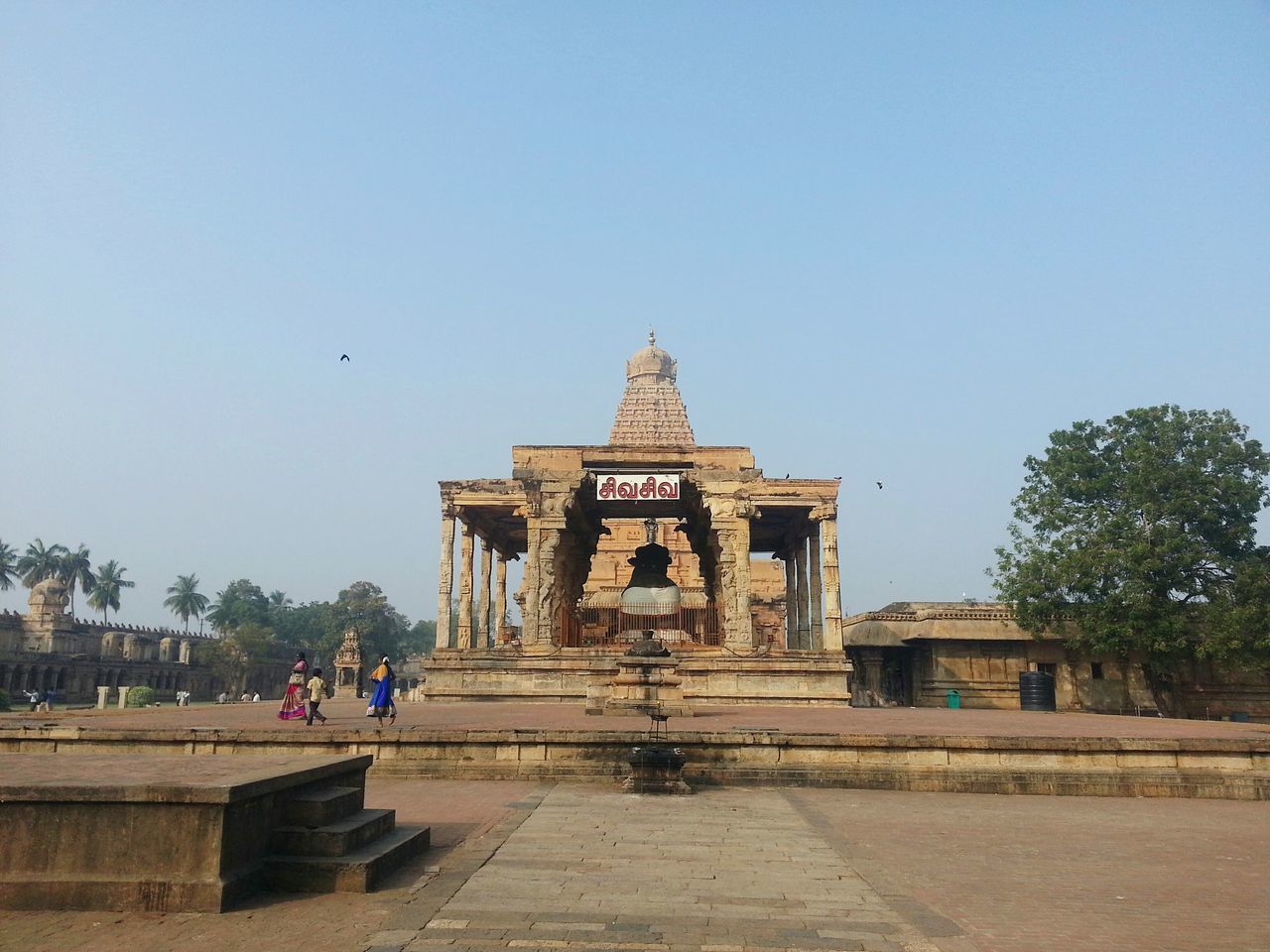 GROUP OF PEOPLE OUTSIDE TEMPLE