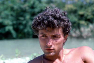 Close-up portrait of shirtless man