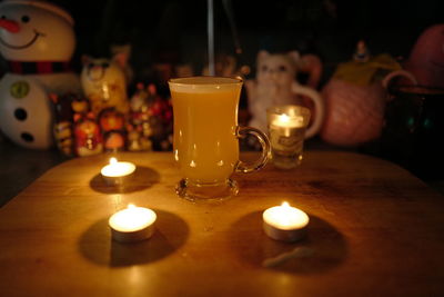 Close-up of tea light candles on table