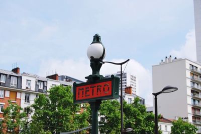 Street light by road against sky