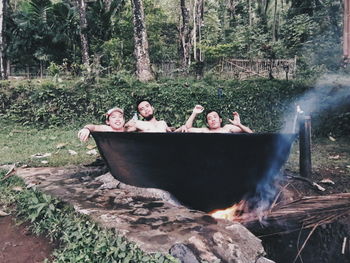 Close-up of men relaxing in field