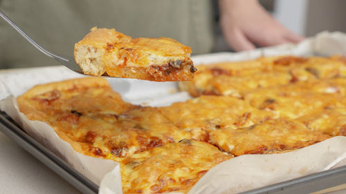 Cropped hand of person preparing food